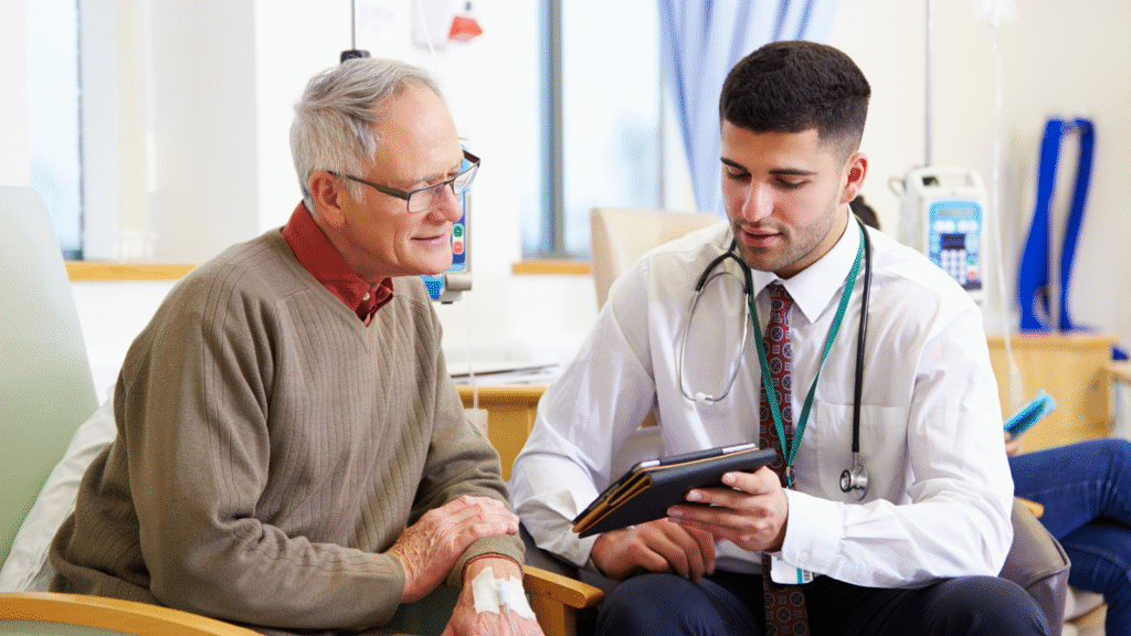 Doctor consulting with patient in hospital room